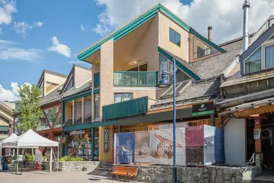 a building on the side of a street at The Ikon Lofted Studio with King Bed and Patio in Whistler