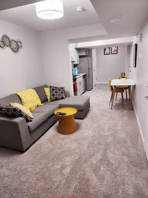 a living room with a couch and a table at Deluxe 2 bedroom suite with*Netflix/Cable/Prime in Edmonton