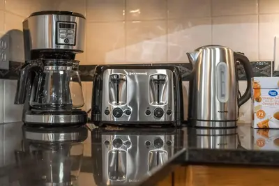 a coffeemaker sitting on top of a kitchen counter at Coral Springs Lakefront Retreat in Calgary
