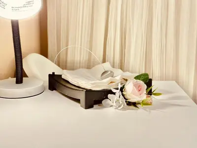 a hospital bed with a bouquet of flowers on a table at Scorpio House Langley ROOM B in Langley
