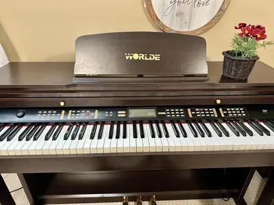 a digital piano sitting on top of a table at Scorpio House Langley ROOM B in Langley
