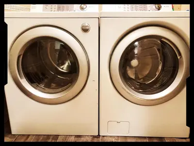 a white washer and dryer sitting next to each other at Scorpio House Langley ROOM B in Langley