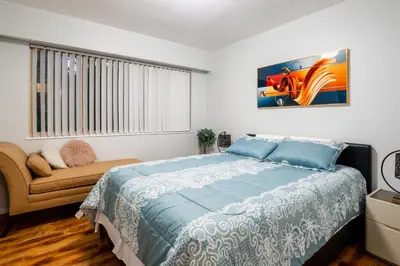a bedroom with a large bed and a window at NorthVAN nature living home in North Vancouver