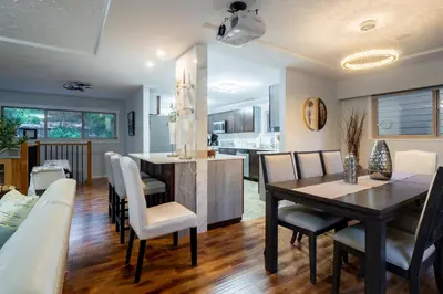 a dining room and kitchen with a table and chairs at NorthVAN nature living home in North Vancouver