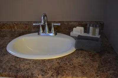 a sink with a faucet on a counter at St. Paul Lodge in St. Paul