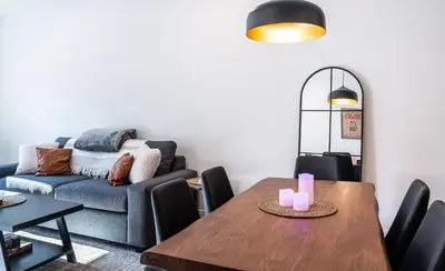 a living room with a table and a couch at Mountainview Escape by Revelstoke Vacations in Revelstoke