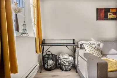 a living room with a couch and a table at Private Town Home with Free Banff Access, Netflix, King Bed, Fully Equipped Kitchen, Sleeps 4 in Calgary