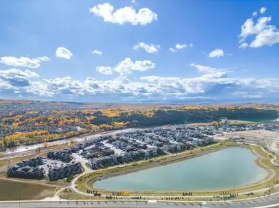 an aerial view of a resort with a lake at Private Town Home with Free Banff Access, Netflix, King Bed, Fully Equipped Kitchen, Sleeps 4 in Calgary