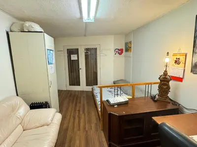 a living room with a couch and a table at Friendly and cozy home with separate entrance No Pets Allowed in Burnaby