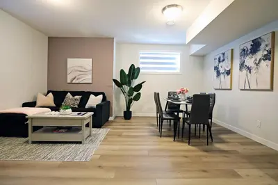 a living room with a couch and a table at Downtown Suite King Beds,Long Stays,Disney+ in Edmonton