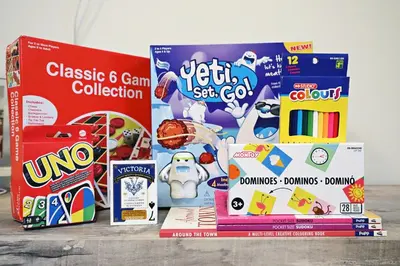 a pile of childrens games and toys on a table at Central Suite King Beds,Long Stays,Disney+ in Edmonton