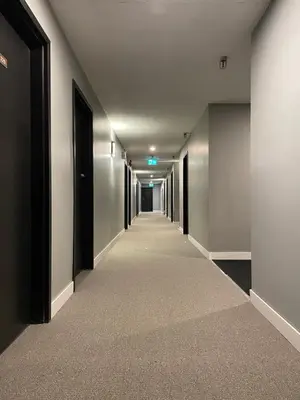 an empty hallway with a long corridor at Nechako Valley Inn in Vanderhoof