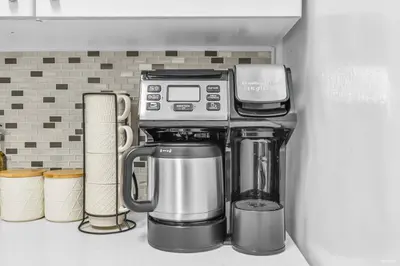 a coffeemaker sitting on a shelf in a kitchen at 1-BR Condo in Downtown Coal Harbour with Parking and City Views in Vancouver