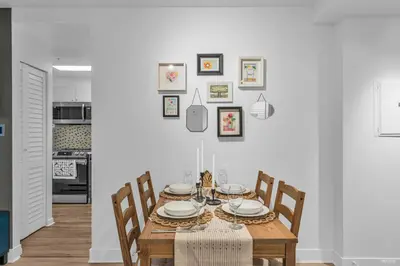 a dining room with a table and chairs at 1-BR Condo in Downtown Coal Harbour with Parking and City Views in Vancouver