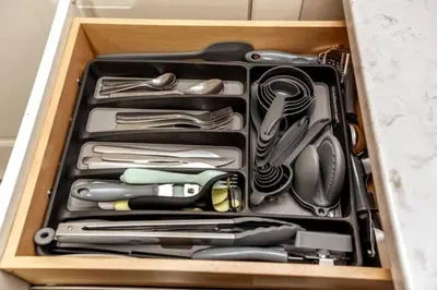 a drawer full of kitchen utensils in a drawer at Chic Suite - Long Stays - King Bed - Fireplace & WiFi in Edmonton