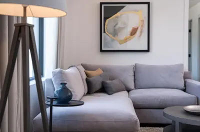 a living room with a couch and a table at The Stoke Stopover - Revelstoke Condo with Hot Tub in Revelstoke