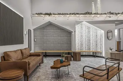 a living room with a couch and a table at W116 NEW! Central Canmore- Whimsical Mountain Retreat in Canmore