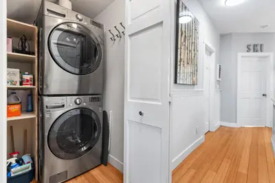 a laundry room with a washer and dryer at 2BR in Granite Court, Village Location, Gas Fireplace, Mudroom, Secure Parking in Whistler
