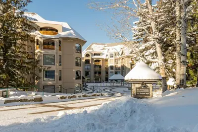 a gazebo in the snow in front of a building at 1BR in Marquise, Near Ski Hill, Fireplace, Heated Pool, Hot Tub, Sauna, Gym, Free Shuttle in Whistler