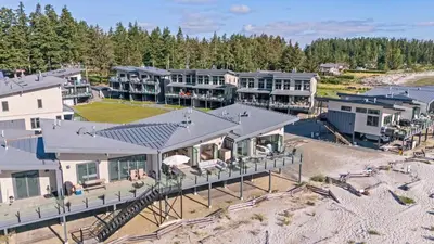 an aerial view of a house on the beach at Beachfront Luxury Suite #15 at THE BEACH HOUSE in Campbell River
