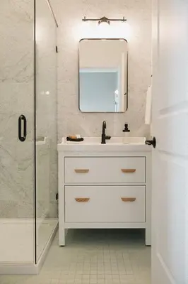a white bathroom with a sink and a shower at Hotel Morado in Chilliwack