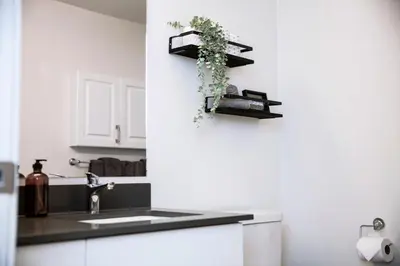 a kitchen with a sink and a counter top at Absolutely Revy - Ground Level Condo in Revelstoke in Revelstoke