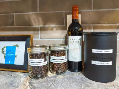 three jars of nuts and a bottle of wine at 2 Bedroom and Wall Bed Mountain Getaway Ski In Ski Out Condo with Hot Pools Sleeps 8 in Panorama