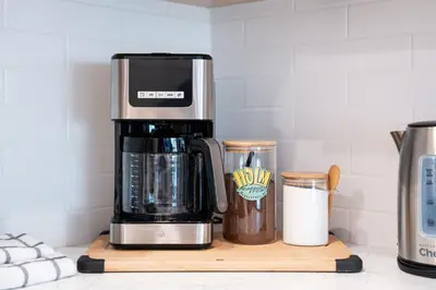 a coffeemaker and a coffee maker on a counter at Mountainside Revival by Revelstoke Vacations in Revelstoke
