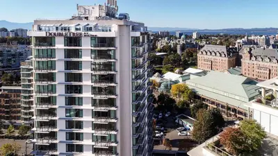 an aerial view of a tall building in a city at DoubleTree by Hilton Hotel & Suites Victoria in Victoria