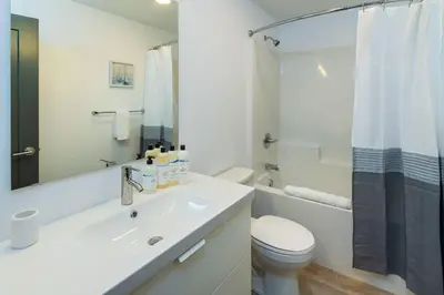 a bathroom with a sink and a toilet and a shower at NN - The Current 2 - Downtown 1-Bed 1-Bath in Whitehorse