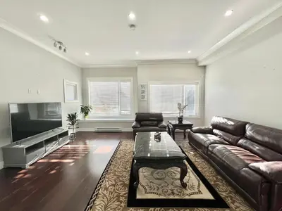 a living room with a couch and a tv at Spacious Home in Richmond in Richmond