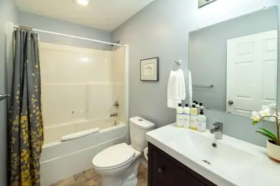 a bathroom with a toilet and a sink and a shower at NN - The Mack - Crestview 1-bed 1-bath in Whitehorse
