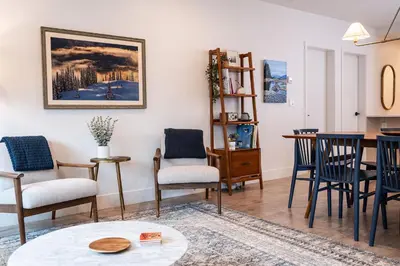 a living room with chairs and a table at Powder Pines Retreat by Revelstoke Vacations in Revelstoke