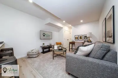 a living room with a couch and a table at Modern Suite King Bed Near Whyte Ave and U of A WIFI in Edmonton