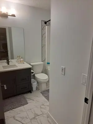 a bathroom with a toilet and a sink at PeaceHouse for females only - Business visits in Calgary
