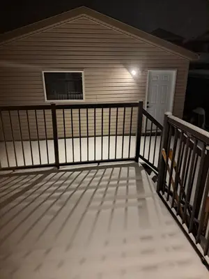 a balcony of a home at night with a window at PeaceHouse for females only - Business visits in Calgary
