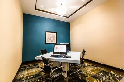 a room with a desk with a laptop on it at Holiday Inn Express & Suites Spruce Grove - Stony Plain by IHG in Spruce Grove