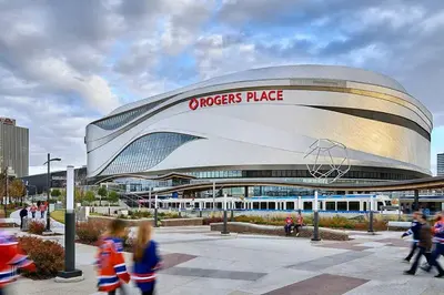 a group of children walking in front of a sports arena at Modern Country Retreat-5 min to DTN-U/G Parking in Edmonton