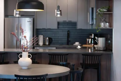 a kitchen with a table with a vase on it at Villa 23 Cabot Peaks by Revelstoke Vacations in Revelstoke