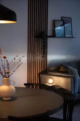 a living room with a table and a couch at Villa 23 Cabot Peaks by Revelstoke Vacations in Revelstoke