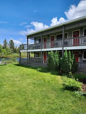 a large house with a lawn in front of it at Campbell River Lodge in Campbell River