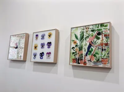 a group of three pictures hanging on a wall at Vancouver’s Homey Laneway House in Vancouver