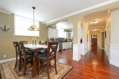 a kitchen and dining room with a table and chairs at Upscale Character Home with Luxurious Amenities in Victoria