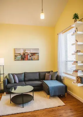 a living room with a couch and a table at The Niven Lake Retreat in Yellowknife