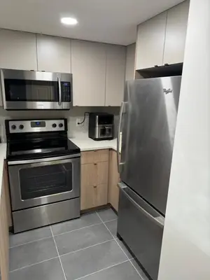 a kitchen with a stainless steel refrigerator and microwave at Beautiful 1BR 1BA Apartment at NORTHSTAR-Whistler, BC in Whistler