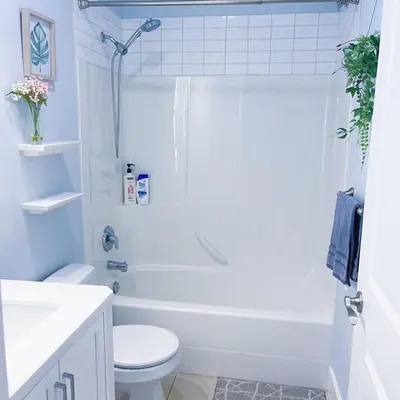 a white bathroom with a toilet and a sink at Ground level two bedrooms Suite near Lake and Golf Course in Victoria