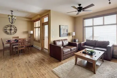 a living room with a couch and a table at Luxury Aspens 2 Bdrm Condo with Best Views in Big White