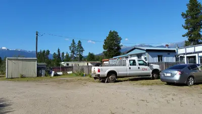 a white truck parked in front of a house at Right Choice Home Valemount in Valemount