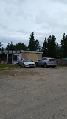 two cars parked in front of a house at Right Choice Home Valemount in Valemount