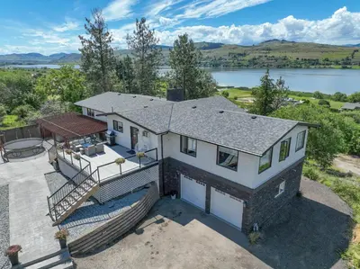 an overhead view of a house with a view of a lake at Lakeviews, big yard/deck, minutes to Silver Star/Golf/Wineries. in Vernon
